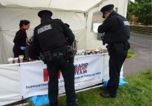 Police take a break at the RRT tent