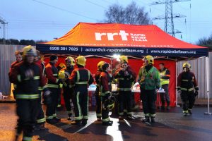 Fire crews and other emergency personnel around the RRT tent