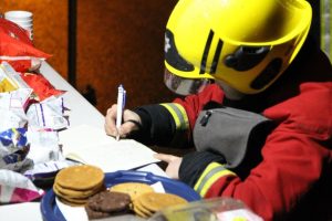 Firefighters leave messages of appreciation at the RRT tent